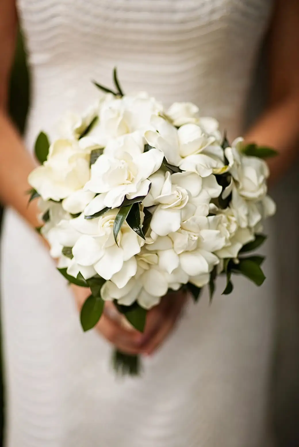 bride with gardenia bouquet