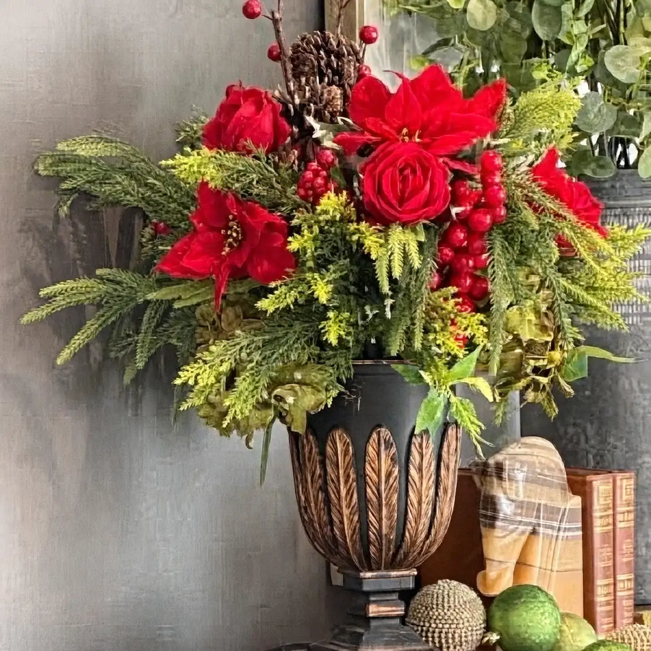 poinsettia vase arrangement evergreens pinecones