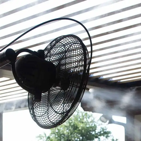 sage on balcony with fan