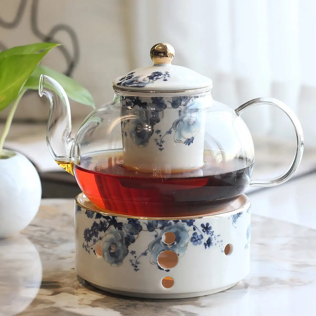 rose geranium tea in glass teapot