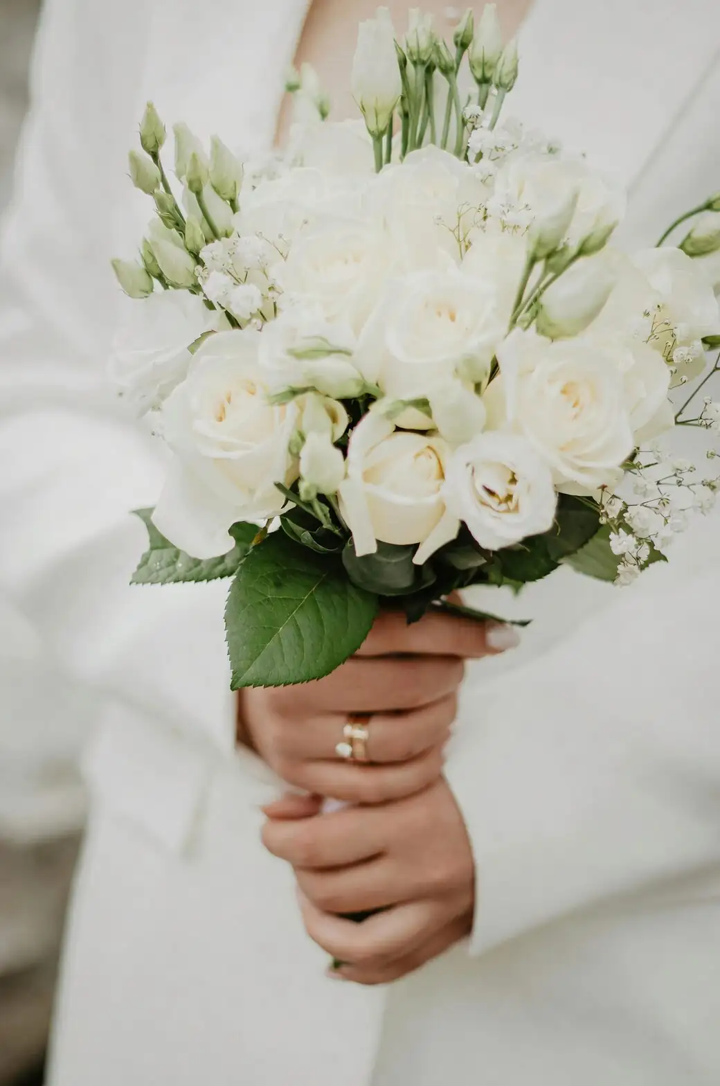 white freesia bridal bouquet hands