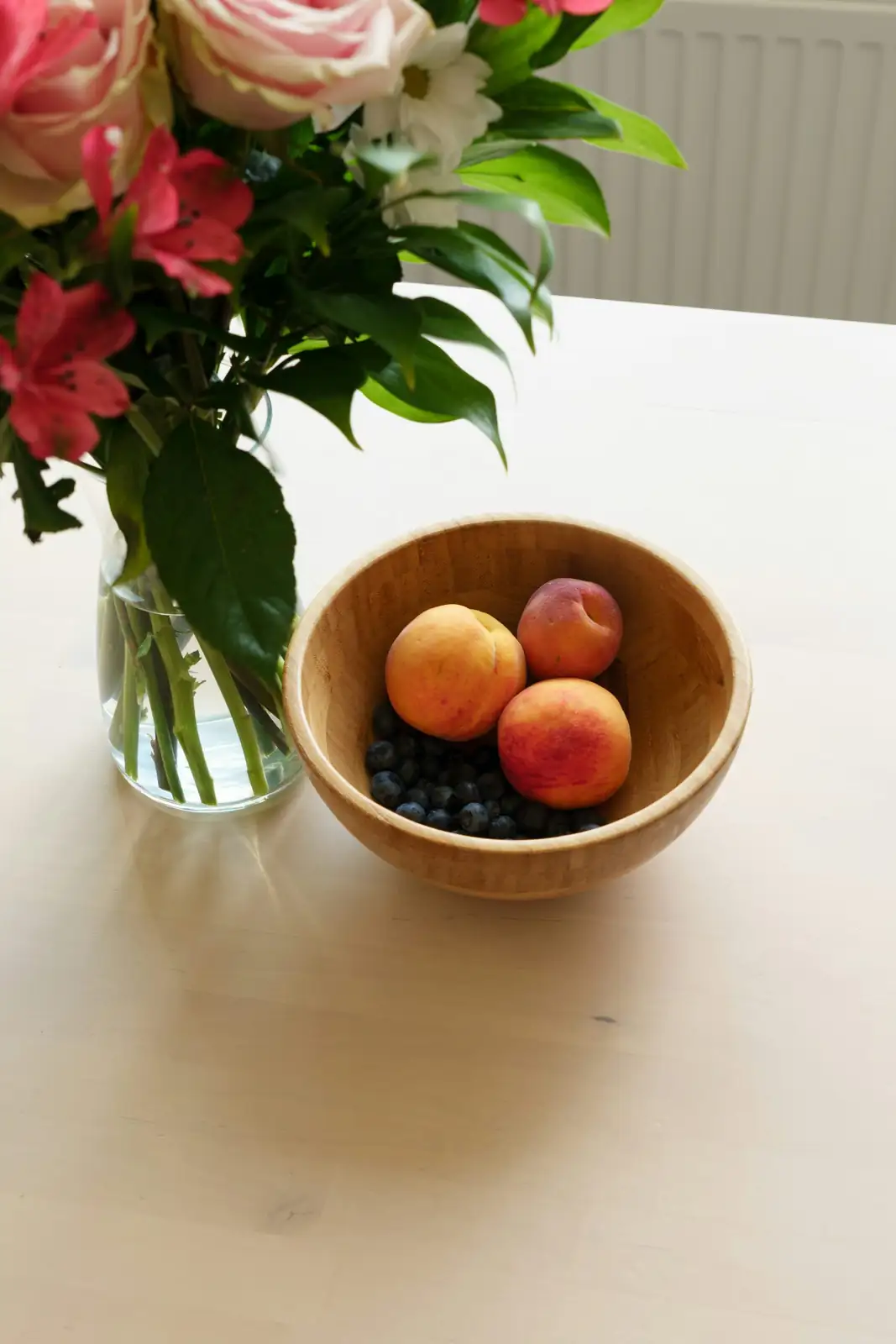 anemone coronaria with fruit bowl